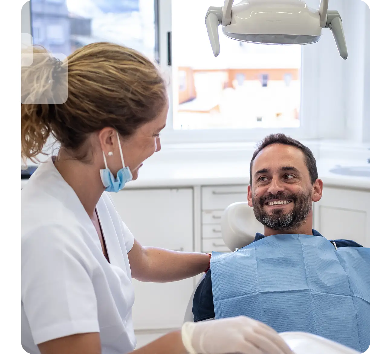Dentist with patient in dental clinic.