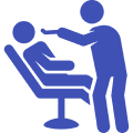 Dentist treating patient in dental chair.