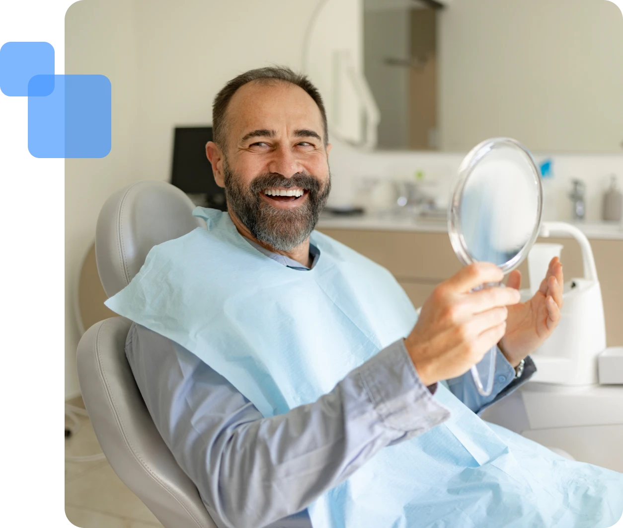 Man smiling with mirror at dentist's office.