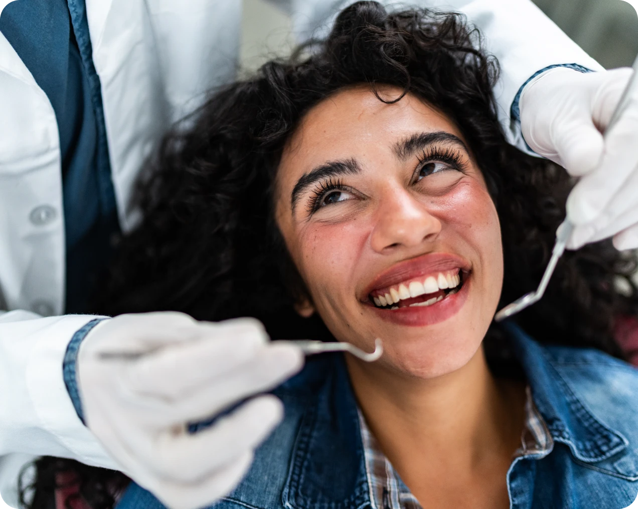 Woman smiling during a dental check-up.